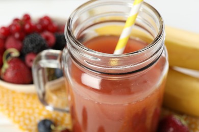 Photo of Superfood. Healthy drink in mason jar and ingredients on white table, closeup