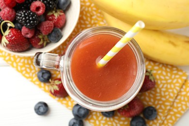 Photo of Superfood. Healthy drink in mason jar and ingredients on white table, flat lay