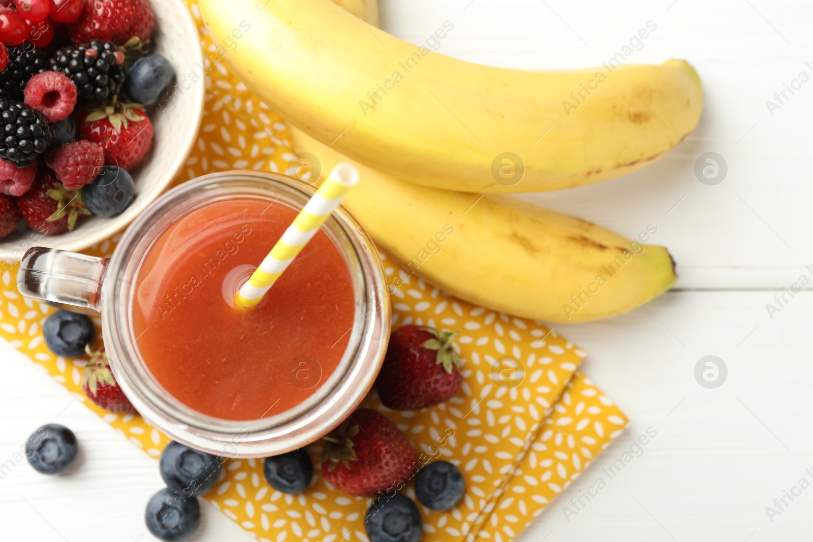 Superfood. Healthy drink in mason jar and ingredients on white wooden table, flat lay Photo of Superfood. Healthy drink in mason jar and ingredients on white wooden table, flat lay