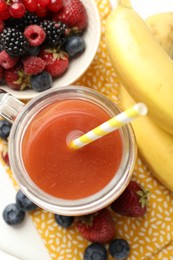 Photo of Superfood. Healthy drink in mason jar and ingredients on white wooden table, flat lay
