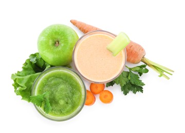 Photo of Superfood. Tasty smoothies in glasses and ingredients isolated on white, top view