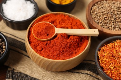 Photo of Different aromatic spices on table, closeup view
