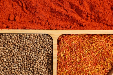 Photo of Different aromatic spices as background, top view