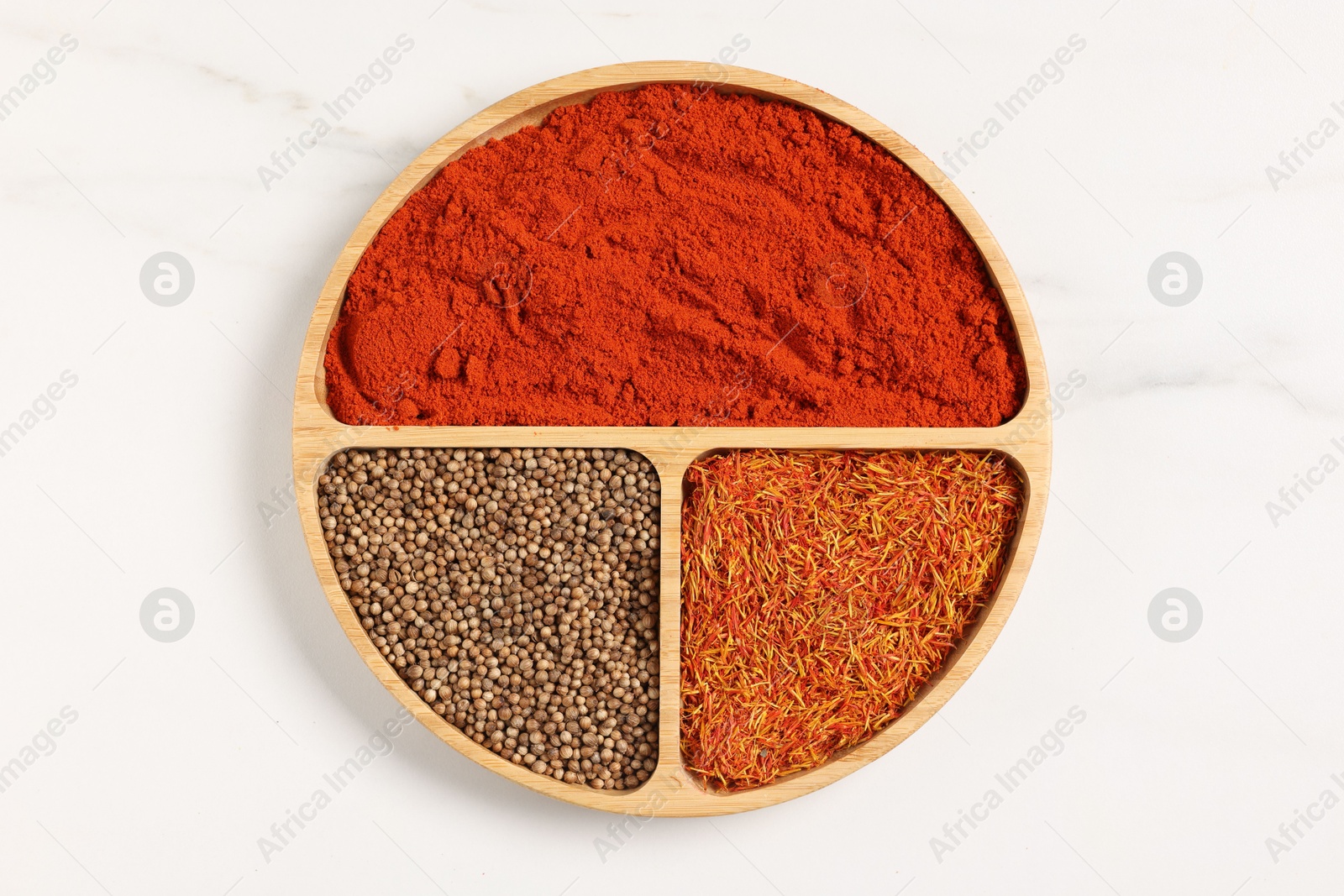 Different aromatic spices on white marble table, top view Photo of Different aromatic spices on white marble table, top view