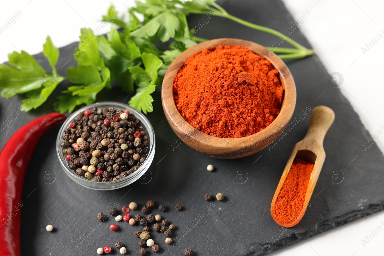 Different aromatic spices on white table, closeup Photo of Different aromatic spices on white table, closeup