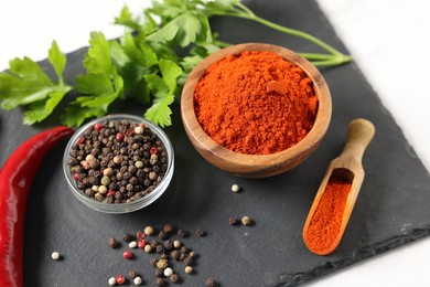 Photo of Different aromatic spices on white table, closeup