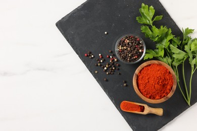 Photo of Different aromatic spices on white marble table, top view. Space for text