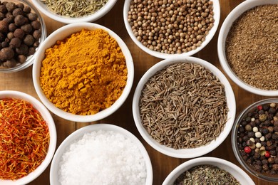 Photo of Different aromatic spices on table, flat lay