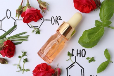 Photo of Bottle of cosmetic product, herbs and red roses on paper with chemical formulas, flat lay
