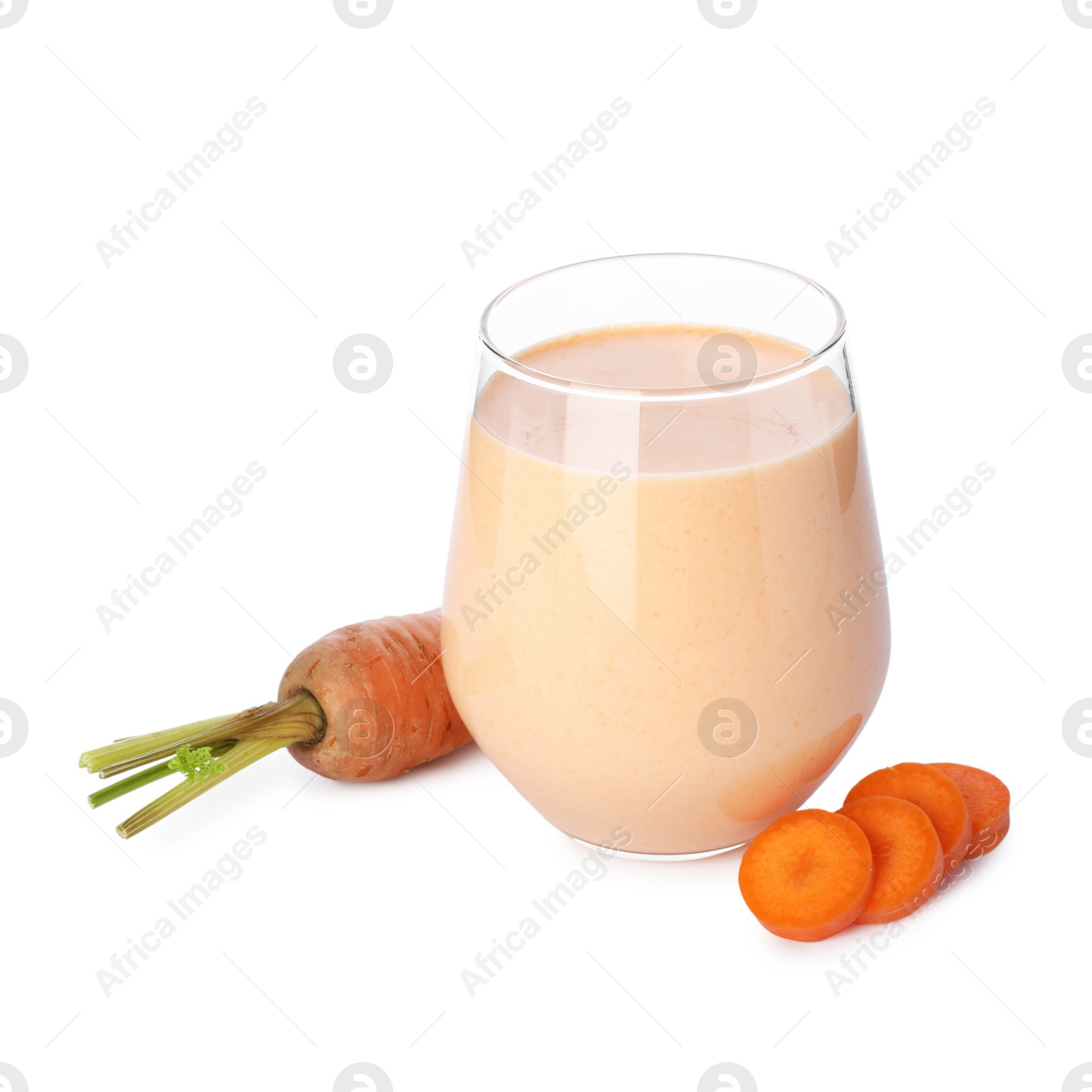 Superfood. Tasty smoothie in glass and carrot isolated on white Photo of Superfood. Tasty smoothie in glass and carrot isolated on white