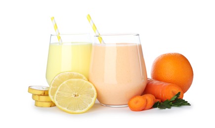 Photo of Superfood. Tasty smoothies in glasses and ingredients isolated on white