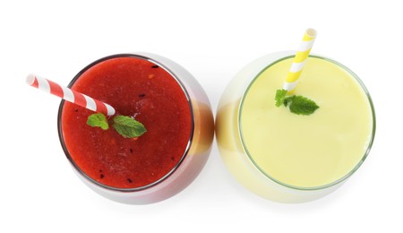 Photo of Superfood. Tasty smoothies in glasses isolated on white, top view