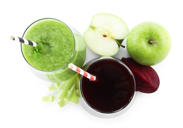Photo of Superfood. Tasty smoothies in glasses and ingredients isolated on white, top view