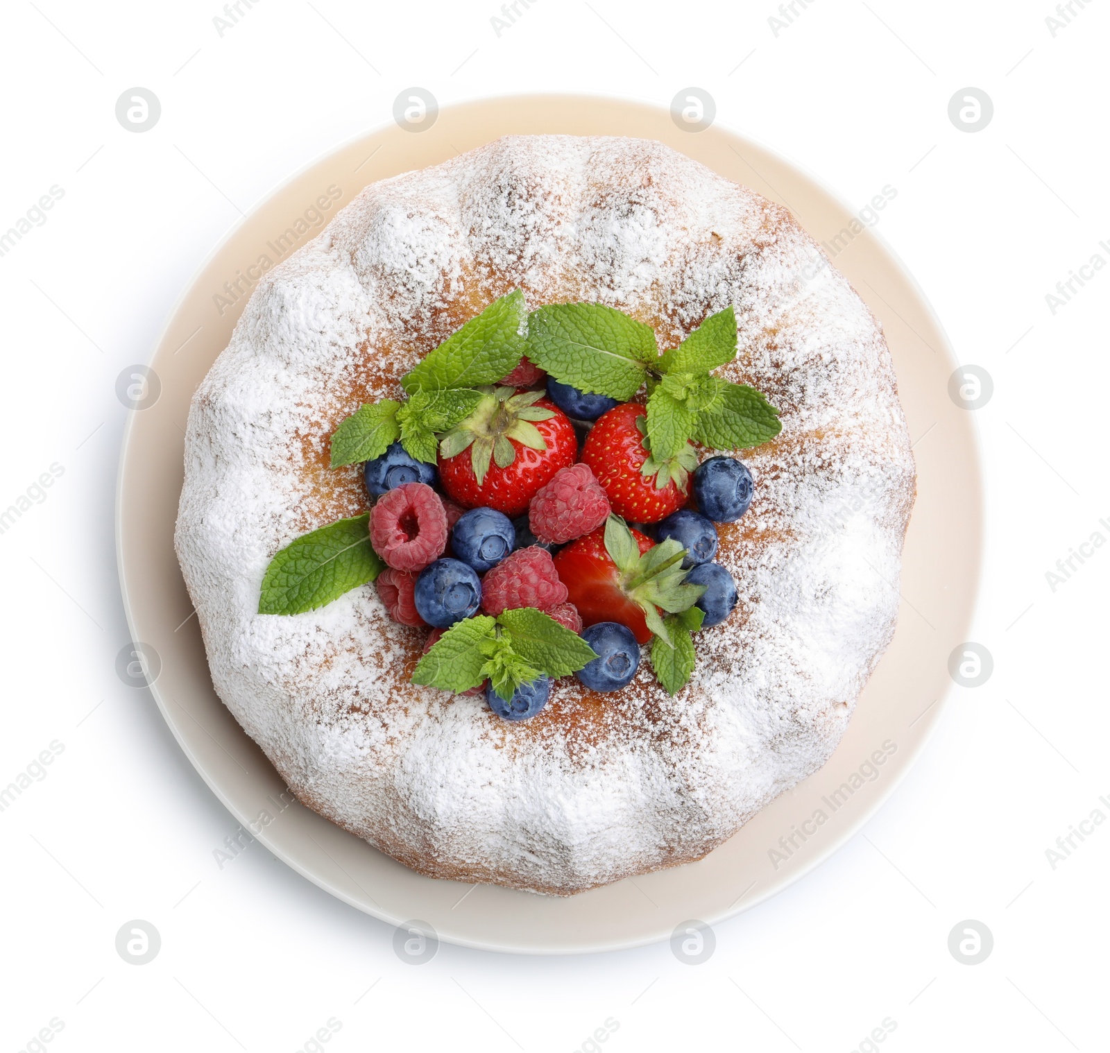 Tasty Bundt cake with powdered sugar and berries isolated on white, top view Photo of Tasty Bundt cake with powdered sugar and berries isolated on white, top view