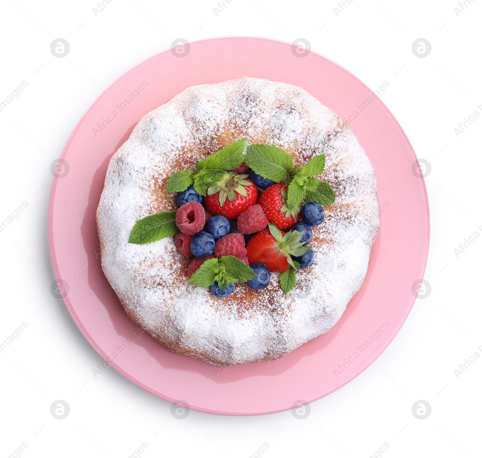 Tasty Bundt cake with powdered sugar and berries isolated on white, top view Photo of Tasty Bundt cake with powdered sugar and berries isolated on white, top view