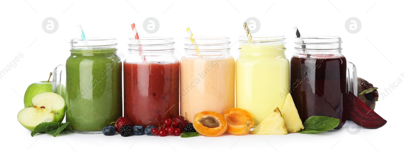 Superfood. Different tasty smoothies in mason jars and ingredients isolated on white Photo of Superfood. Different tasty smoothies in mason jars and ingredients isolated on white