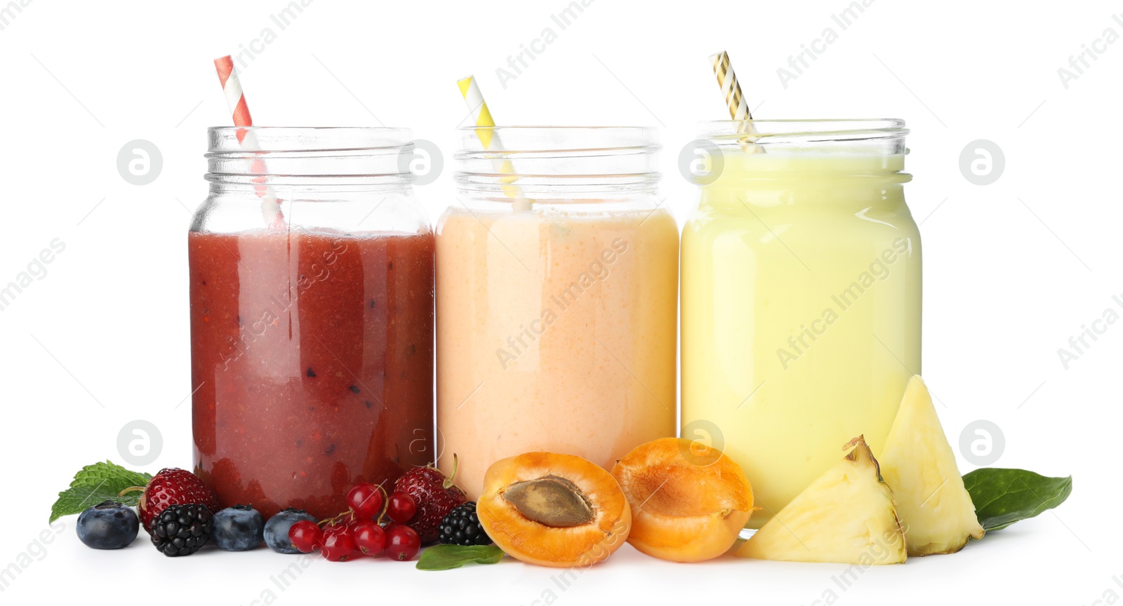 Superfood. Different tasty smoothies in mason jars and ingredients isolated on white Photo of Superfood. Different tasty smoothies in mason jars and ingredients isolated on white