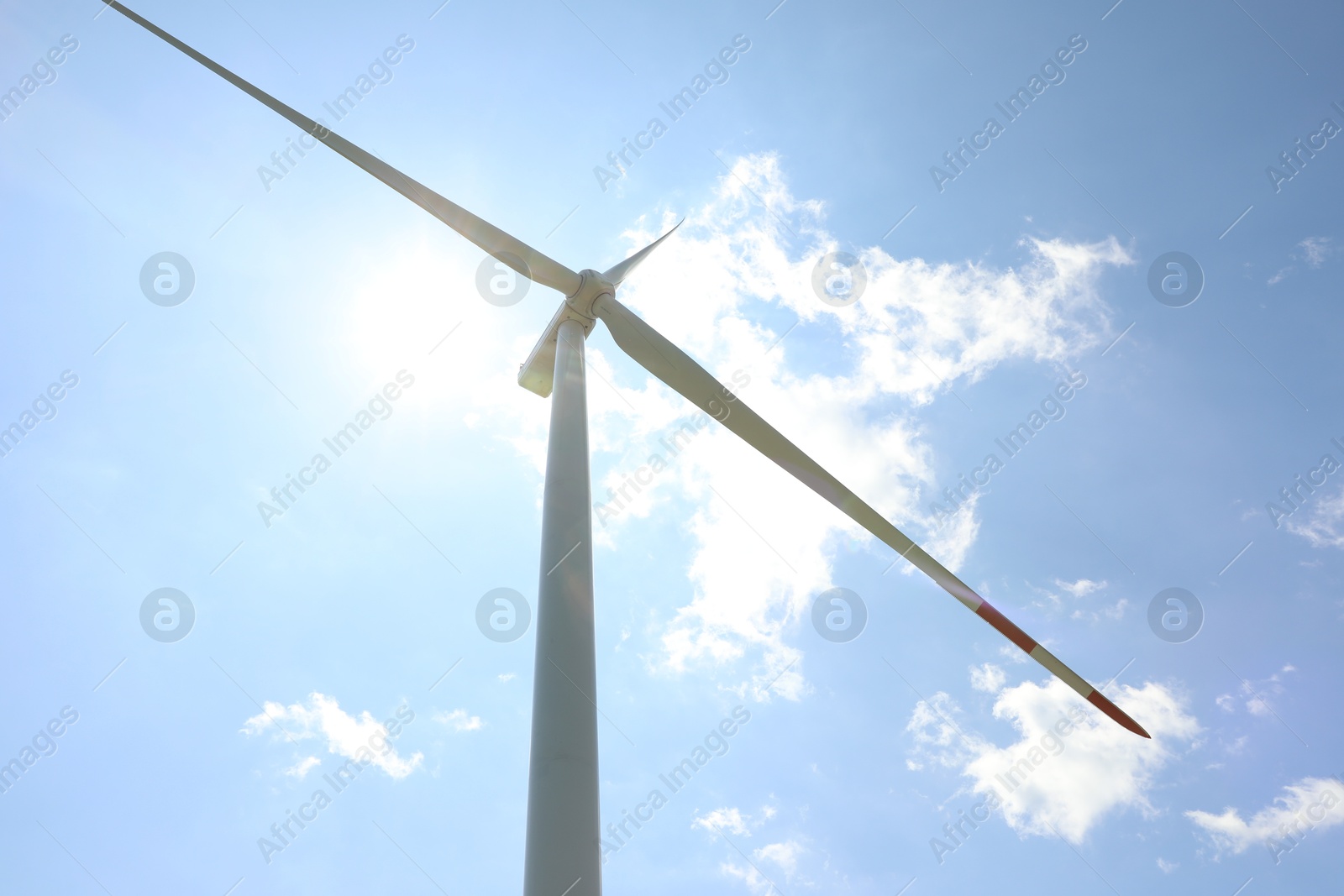Modern wind turbine against blue sky, low angle view Photo of Modern wind turbine against blue sky, low angle view