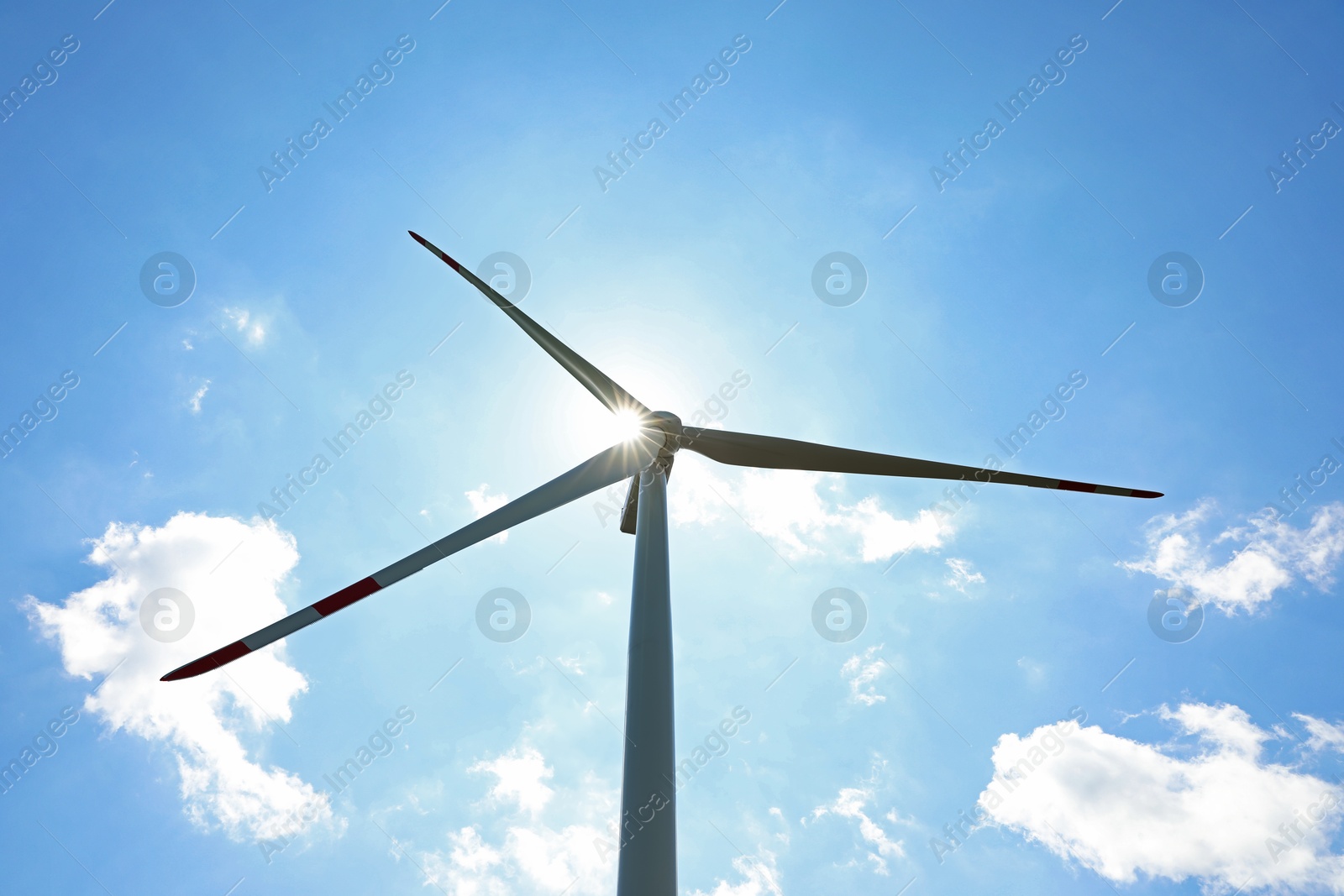 Modern wind turbine against blue sky, low angle view Photo of Modern wind turbine against blue sky, low angle view