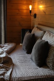 Photo of Big comfortable bed in stylish hotel room