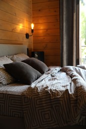 Photo of Big comfortable bed in stylish hotel room