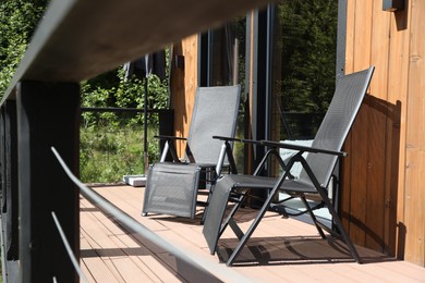 Photo of Cottage terrace with chairs on sunny day