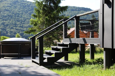 Photo of Wooden stairs to cottage at luxury resort