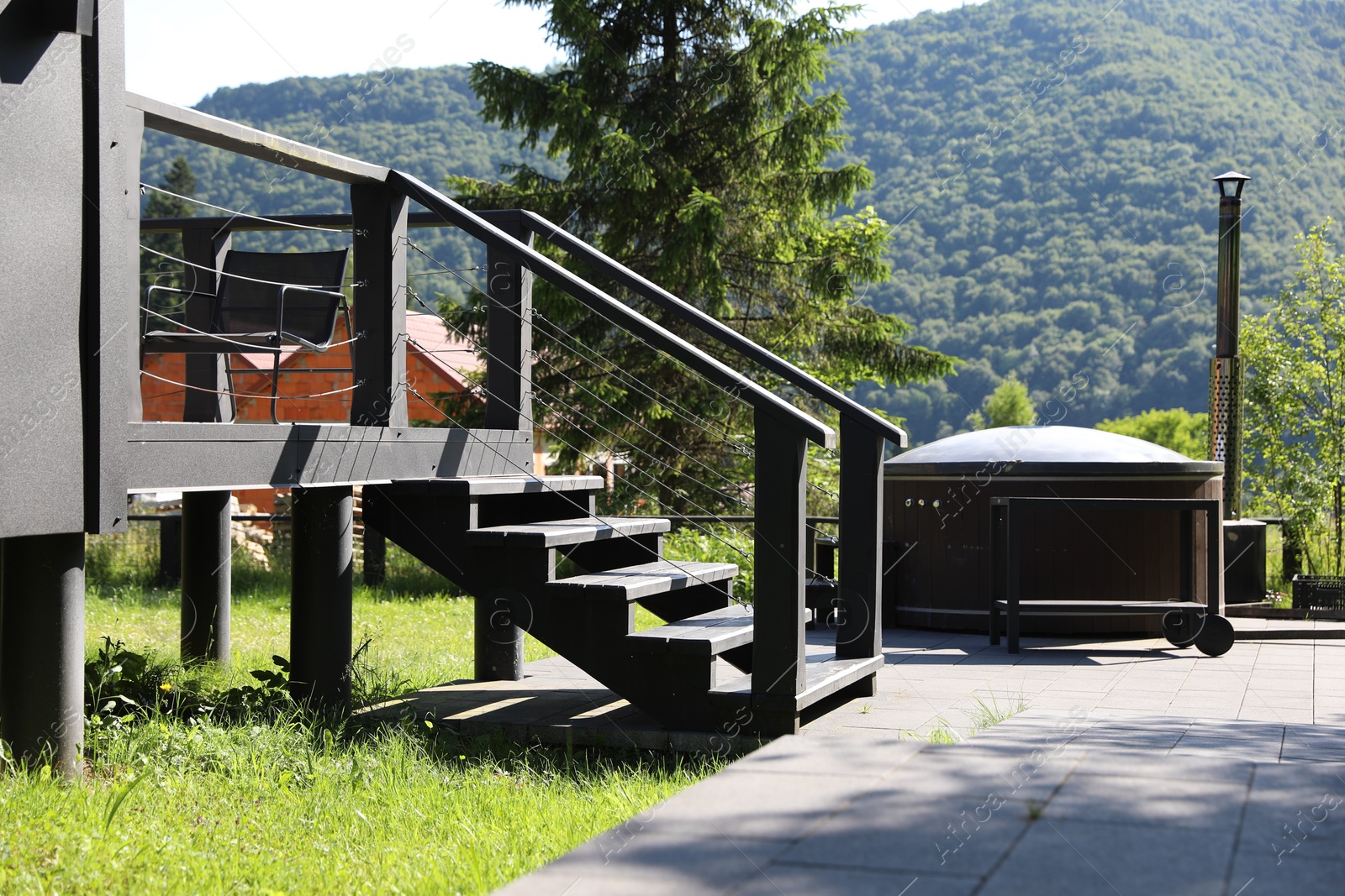 Wooden stairs to cottage at luxury resort Photo of Wooden stairs to cottage at luxury resort