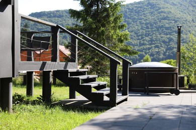 Photo of Wooden stairs to cottage at luxury resort