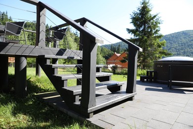 Photo of Wooden stairs to cottage at luxury resort
