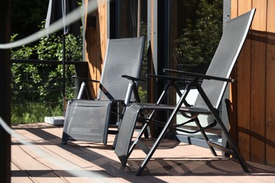 Photo of Cottage terrace with chairs on sunny day