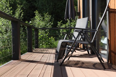Photo of Cottage terrace with chairs on sunny day