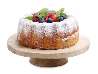 Photo of Tasty Bundt cake with powdered sugar and berries isolated on white