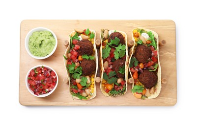 Photo of Tasty vegetarian tacos with falafel, salsa and guacamole isolated on white, top view