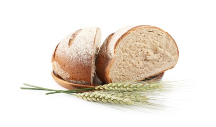 Photo of Pieces of fresh bread and green wheat spikes isolated on white