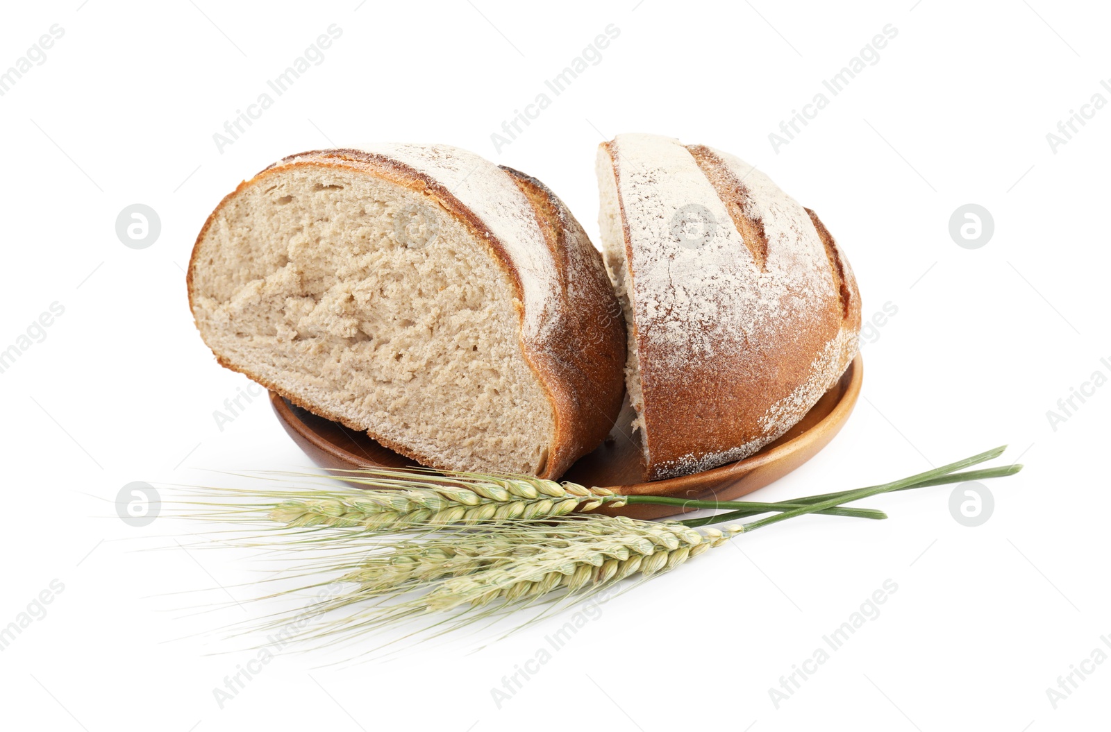 Photo of Pieces of fresh bread and green wheat spikes isolated on white