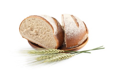 Photo of Pieces of fresh bread and green wheat spikes isolated on white