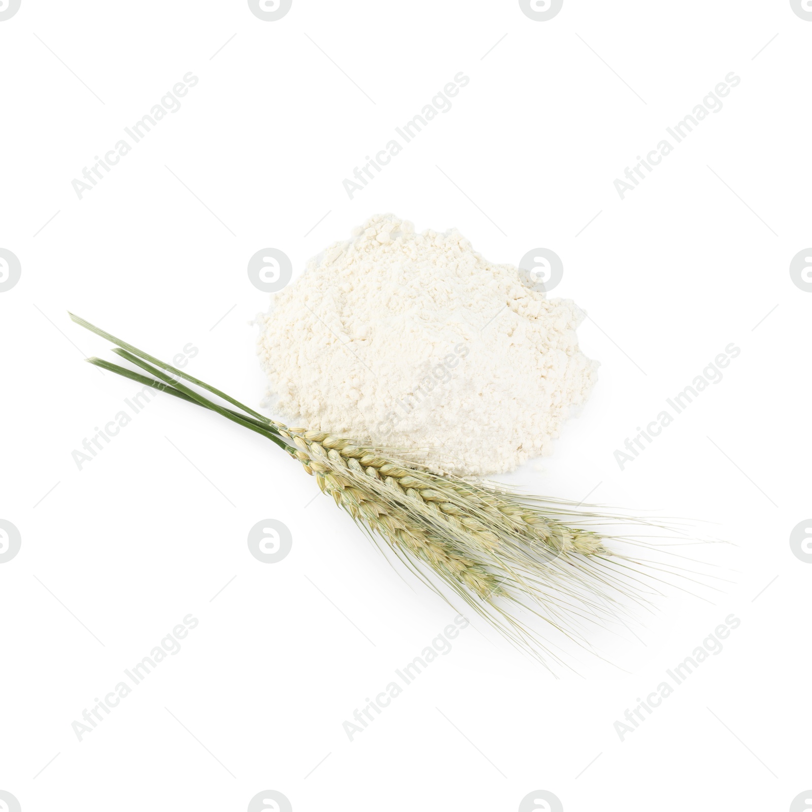 Photo of Pile of flour and green wheat spikes isolated on white, top view