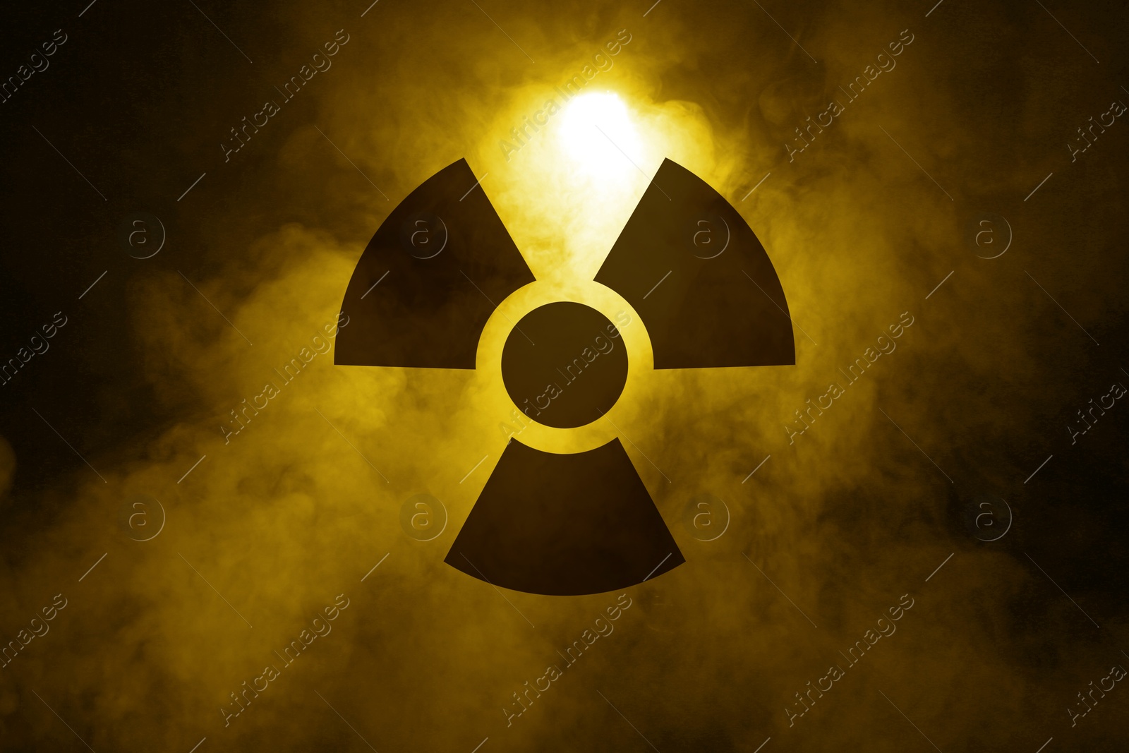 Radioactive sign and yellow toxic smoke against black background Image of Radioactive sign and yellow toxic smoke against black background