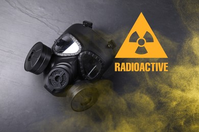 Image of Radiation threat. Gas mask, radioactive sign and smoke on grey background, top view