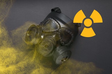 Image of Radiation threat. Gas mask, radioactive sign and smoke on grey background, top view