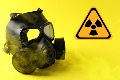 Image of Radiation threat. Gas mask, radioactive sign and smoke on yellow background