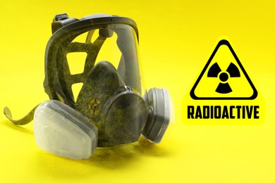 Image of Radiation threat. Gas mask, radioactive sign and smoke on yellow background