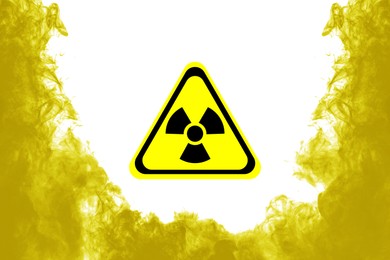 Image of Radioactive sign and yellow toxic smoke against white background