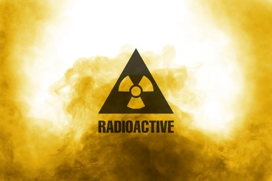 Image of Radioactive sign and yellow toxic smoke against white background