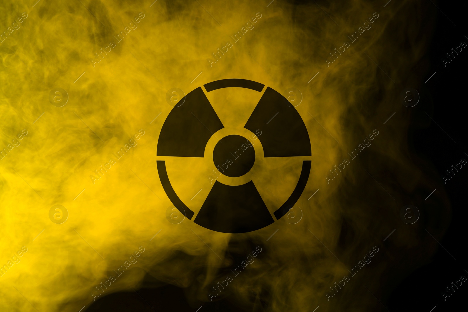 Radioactive sign and yellow toxic smoke against black background Image of Radioactive sign and yellow toxic smoke against black background