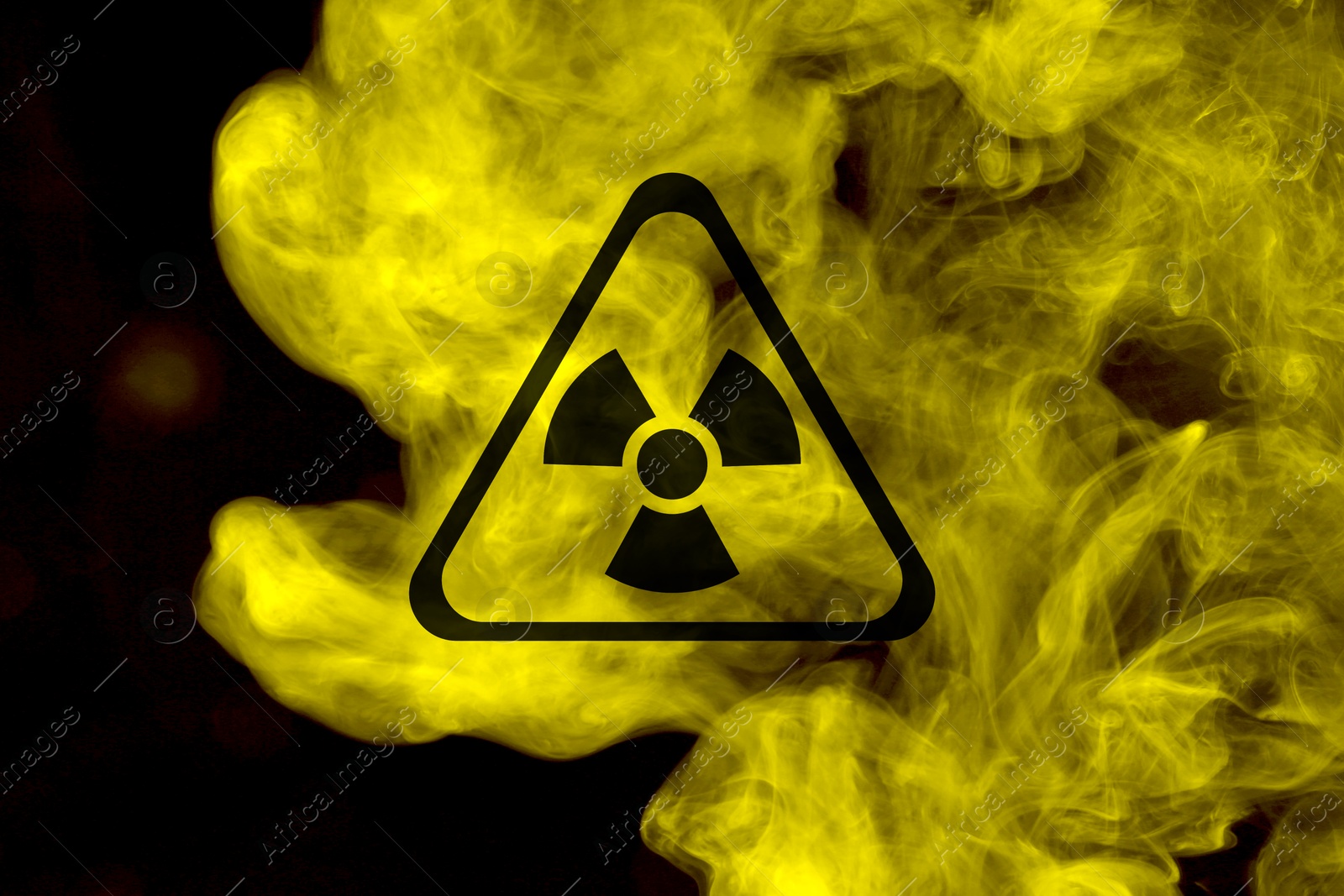 Radioactive sign and yellow toxic smoke against black background Image of Radioactive sign and yellow toxic smoke against black background