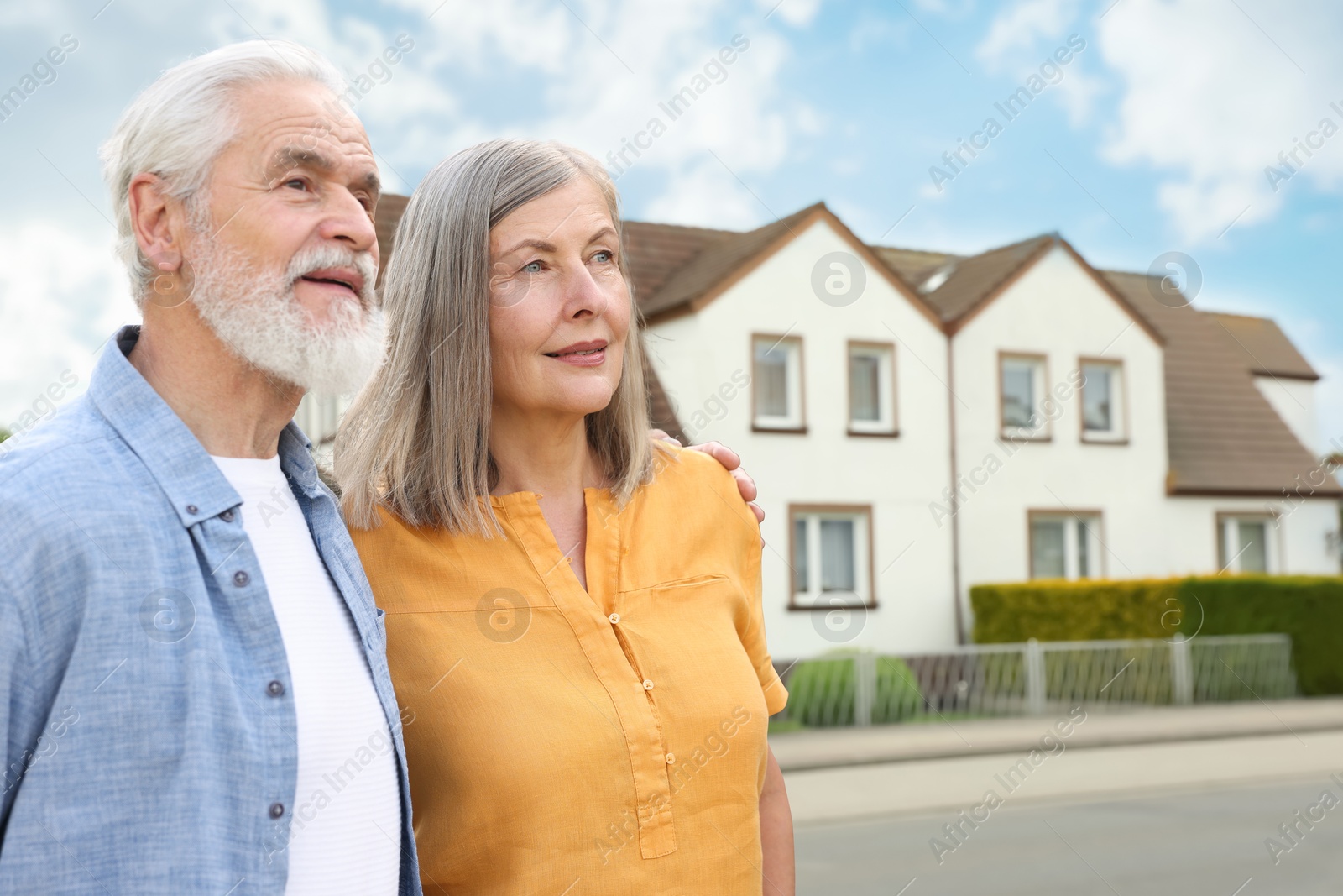 Senior couple near their house outdoors. Real estate ownership Image of Senior couple near their house outdoors. Real estate ownership