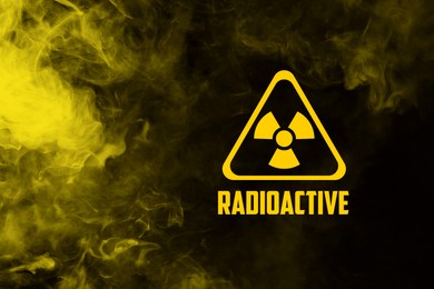 Image of Radioactive sign and yellow toxic smoke against black background