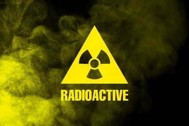 Image of Radioactive sign and yellow toxic smoke against black background